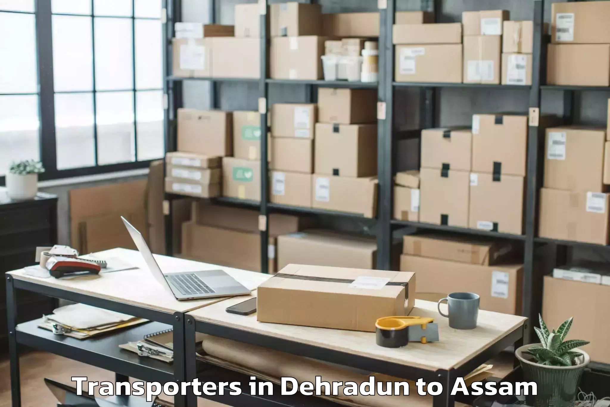 Top Dehradun to Baihata Transporters Available